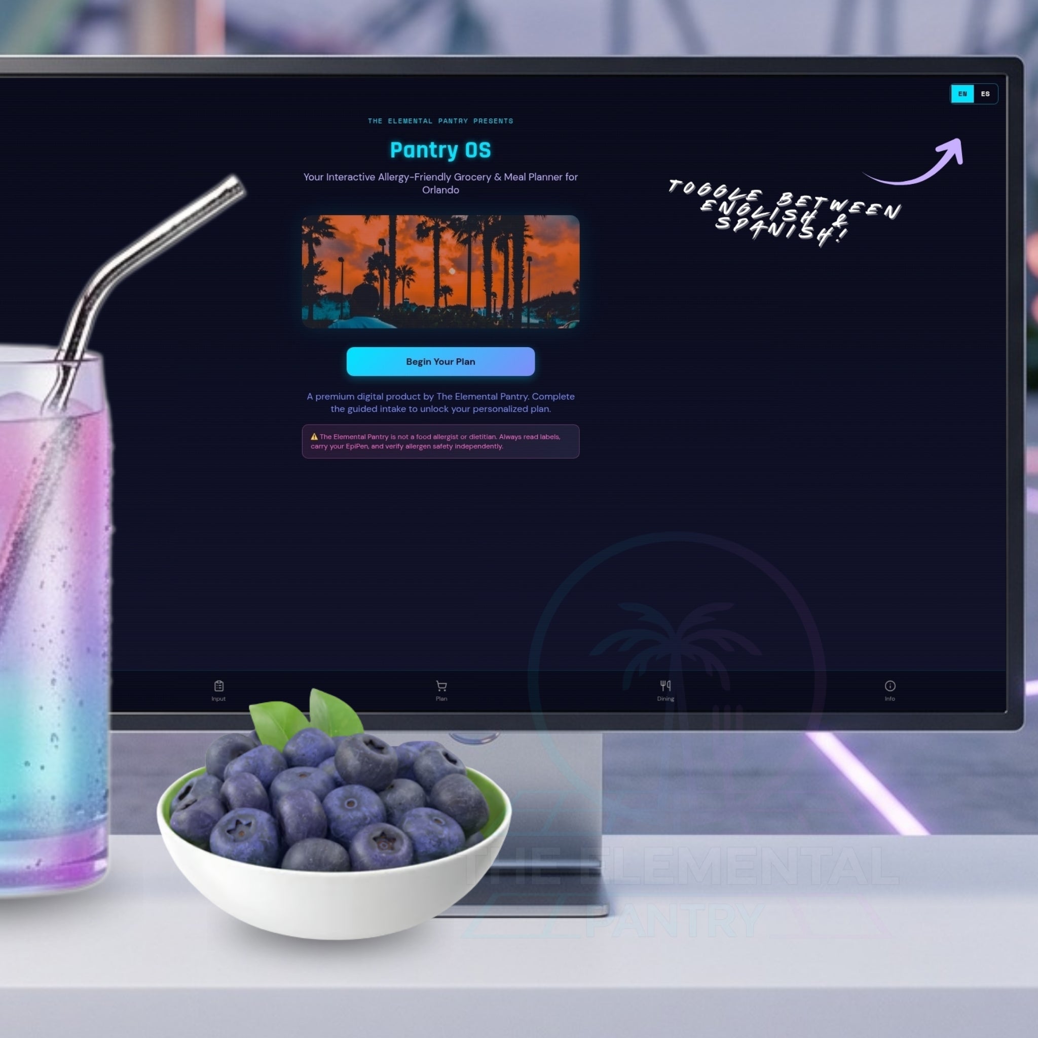 A computer monitor on a desk displaying a software interface titled 'Pantry OS' with a tropical sunset graphic and promotional text. In front of the monitor is a white bowl of blueberries and a glass with a metal straw and pastel drink, set against a blurred modern interior background.